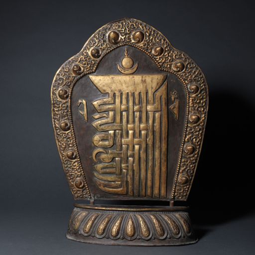 A vertical shot of a Chinese ancient traditional decoration on a grey background