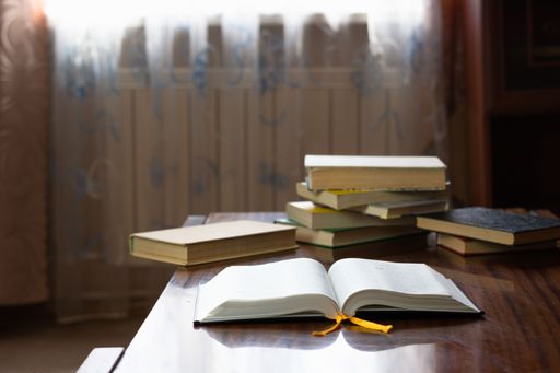 A close up of books and bibles in the ta