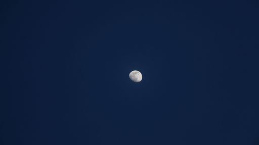 A beautiful view of the Waxing Gibbous Moon in a blue clear sky