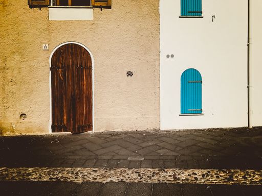 A scenery of old buildings standing next to each other in the middl of the town