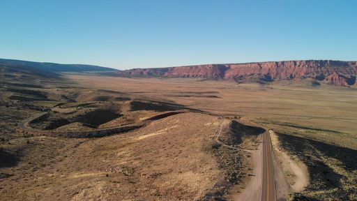 An Aerial view of beautiful road crossing the canyon in summer season.