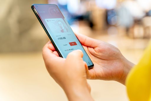 Chongqing, China-May 8th 2022: Chinese customer Using digital currency, the digital yuan on mobile phone when shopping in the mall.