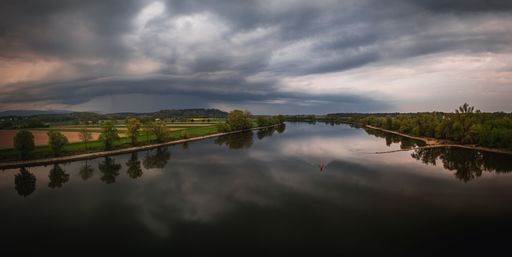 A view of dark clouds before a thunderstorm on the banks of the Danube in Bavaria, Germany