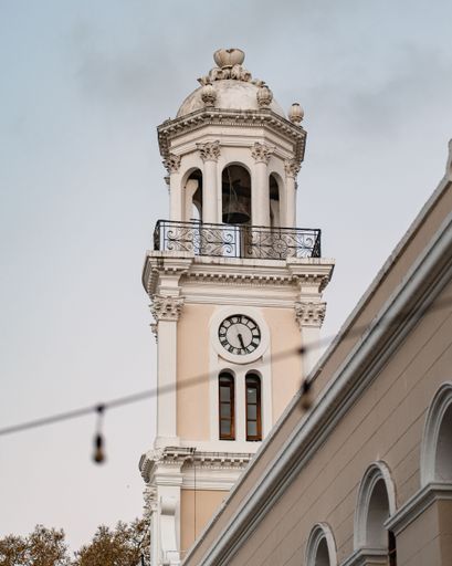 A vertical shot of Palacio Consistorial with cloudy sky