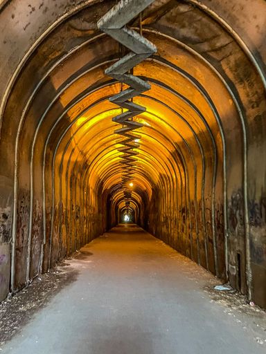 A vertical shot of a tunnel with a zigzag pattern ceiling in the Malibu Park, Armenia