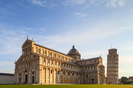A scenic view of the Leaning Tower of Pisa and Pisa Cathedral in Italy on a sunny day