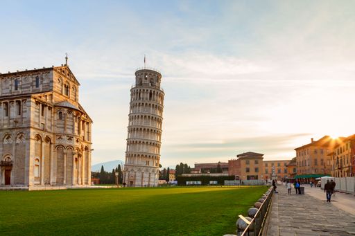 A scenic view of the Leaning Tower of Pisa and Pisa Cathedral in Italy on a sunny day