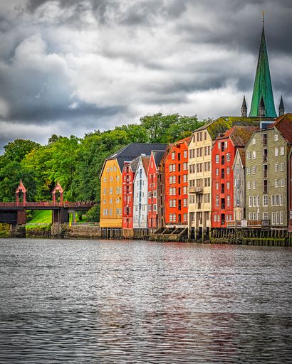A vertical shot of the Nidelva river by the dockside of Trondheim Warehouses