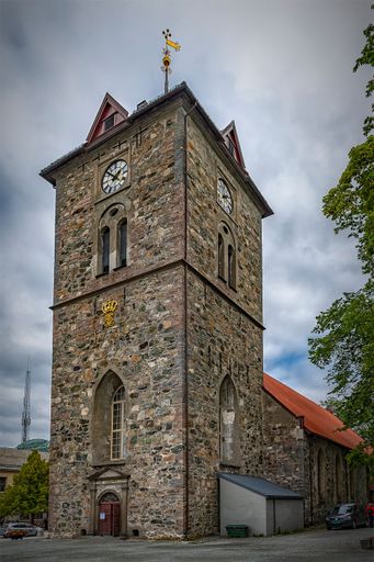 A vertical shot of the tower of the Var Frue church in Trondheim, Norway