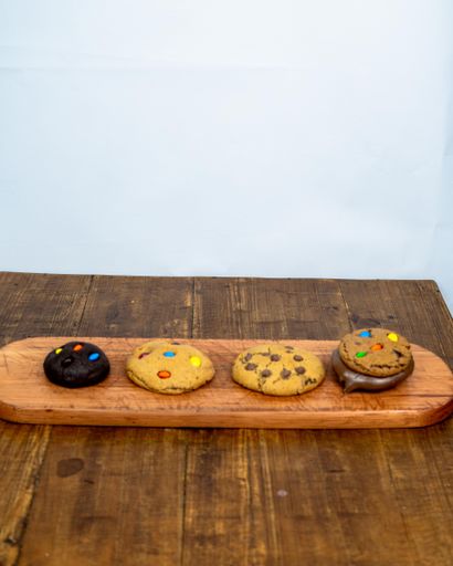 A vertical shot of cookies on wooden board on a table