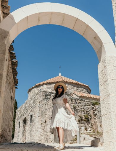 A beautiful Caucasian young woman at Klis fortress near Split in Croatia