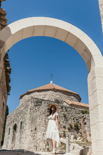 A beautiful Caucasian young woman at Klis fortress near Split in Croatia
