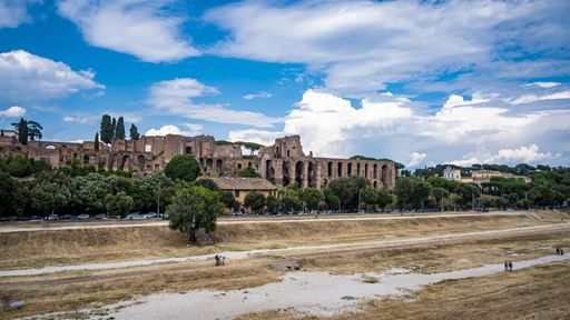 Italy 2020: Esplanade of the Circus Maximus and Roman Forum. We are at the end of spring, the sky is clear and there are clouds. June 2020, Rome