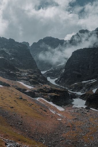 A beautiful shot of foggy rocky mountains