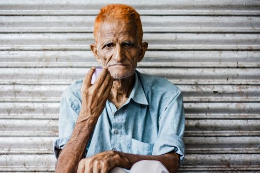 A chai-walla taking a break from his work in an alley in Old Delhi.