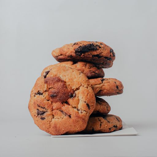 A closeup of stacked cookies with a white background