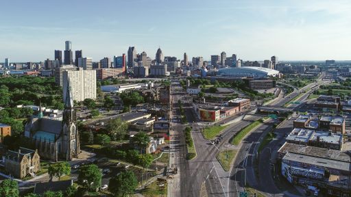 Angle of Detroit City, MI from Gratiot Avenue.  Picture shows skyline of the city, Ford Field, and Rosa Parks mural.
