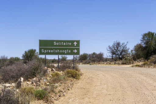 A close up shot of a  road sign with an arrow leading to Soussusvlei, Namibia