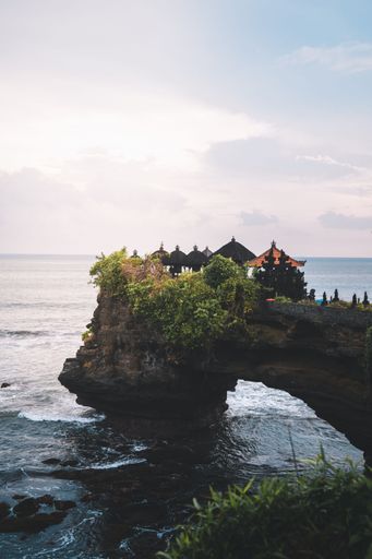 The small temple of Tanah Lot on a cliff over the water in Bali, Indonesia