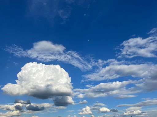 A beautiful view of puffy clouds in the blue sky