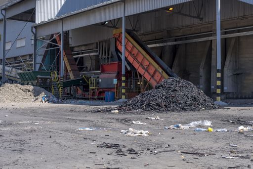 A pile of shredded waste rubber at a waste treatment plant