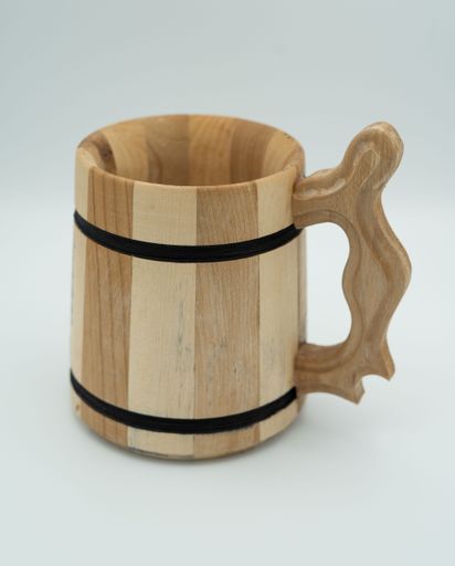 A vertical closeup shot of a wooden tankard isolated on the white background