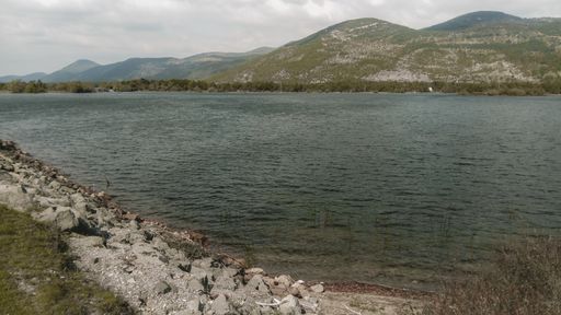 A high angle shot of a wavy lake in a beautiful mountain landscape in Stikada, Croatia