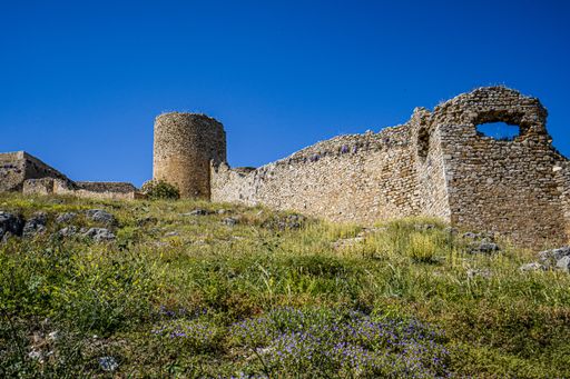 The image shows the Fortress of Larissa, an ancient fortress on the acropolis or highest point in the town of Argos in Greece