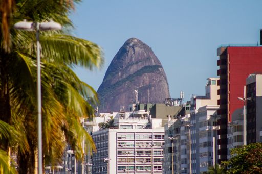 A sunny scenery of Rio de Janeiro's buildings on Two Brothers Hill background