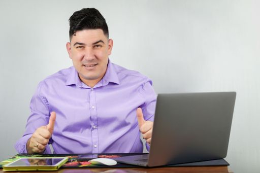 A close up Man performing actions on a laptop greeting, emotions and making video calls
