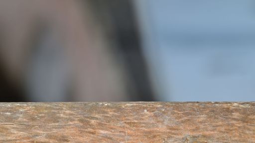 A closeup of weathered wood top in blurred background with copyspace