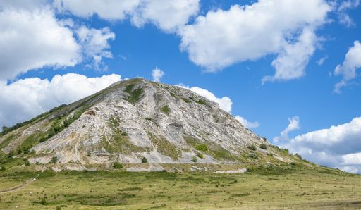 Monument to archeology, mountain lonely shihan Toratau, selected in the short list of the project Seven Wonders of Russia against a blue sky