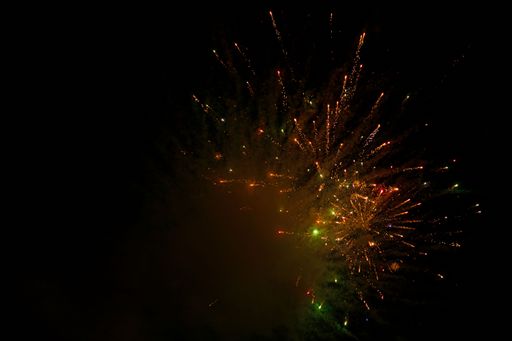 The display of colorful fireworks against the black sky background