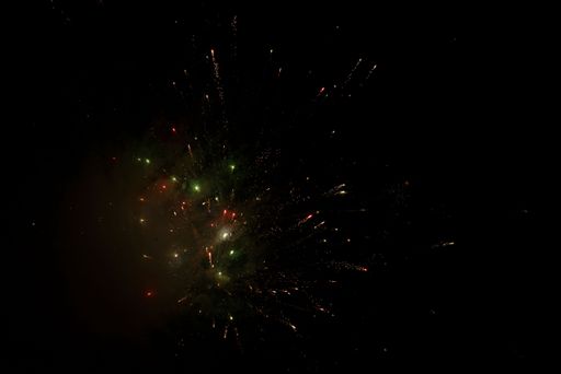 The display of colorful fireworks against the black sky background