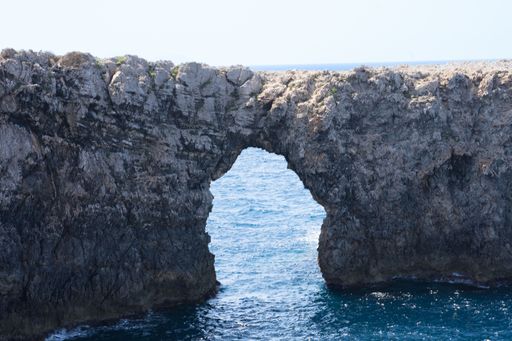 A view of an arch in font den Gil in Menorca, Spain