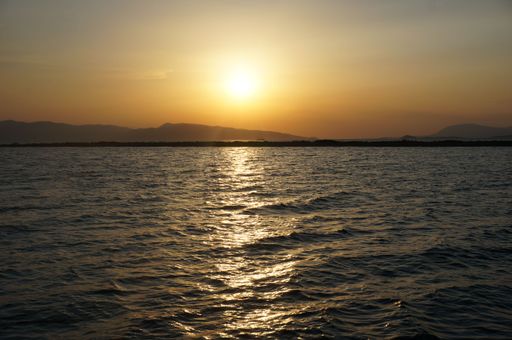 A breathtaking orange sunset view over the rippling ocean