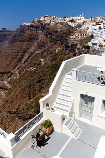 A vertical shot of a traditional house terrace in Santorini, Greece