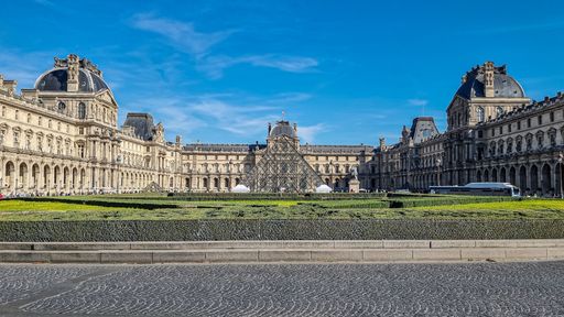 A beautiful view of the Louvre Museum in France under a blue sky
