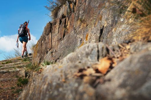 A young woman hiking in the mountains in Piedmont, Italy