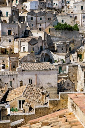 A vertical shot of terraces and rooftops of the ancient stone city Matera, in southern Italy