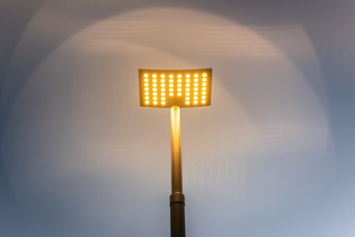 A low angle shot of an illumniated stage stand with spotlight
