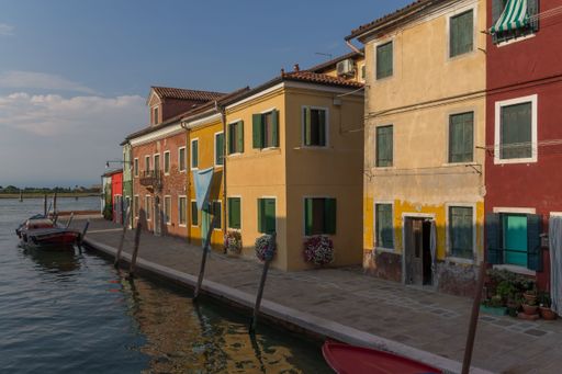 A beautiful view of canal and colorful buildings in Venice, Italy