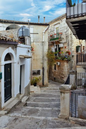 A narrow street in the old town of Modica in Sicily, Italy