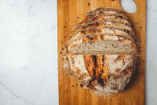 The slices of homemade sourdough bread on a wooden board