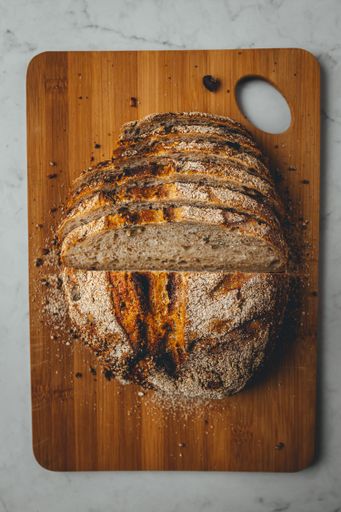 The slices of homemade sourdough bread on a wooden board
