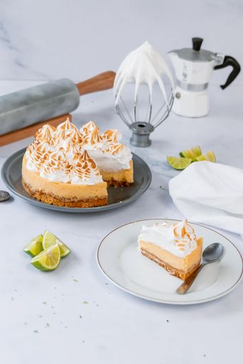 A vertical shot of a yummy lemon cake decorated with whipped cream