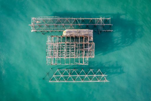 The remains of the West Pier against the turquoise water surface. Brighton, England, United Kingdom.