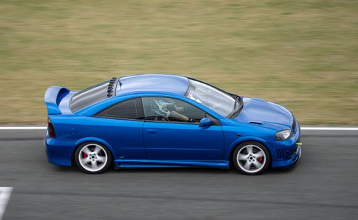 Opel Astra Coupe racing on the race track