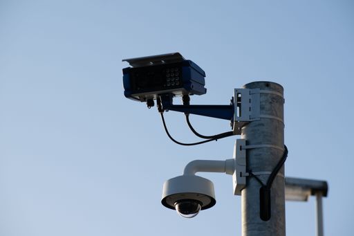 An automatic number plate recognition camera and a decoy surveillance camera on a pole