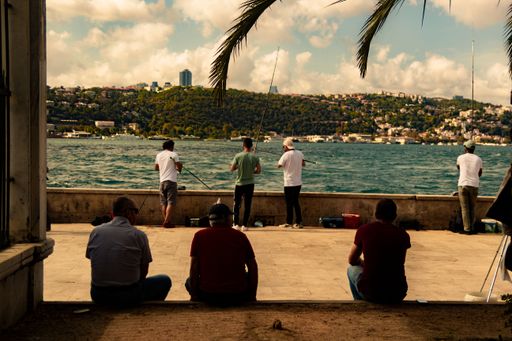 A number fishermen on a sunny day in the Beylerbeyi district of Istanbul, Turkey
